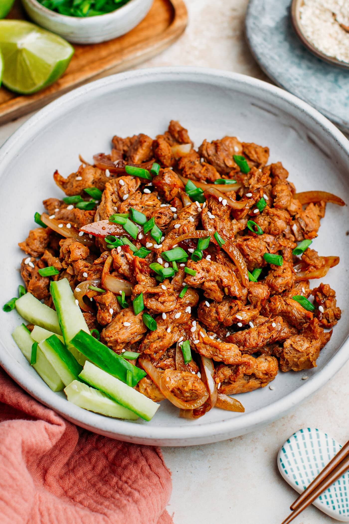 Vegan bulgogi soy curls topped with green onions and sesame seeds.