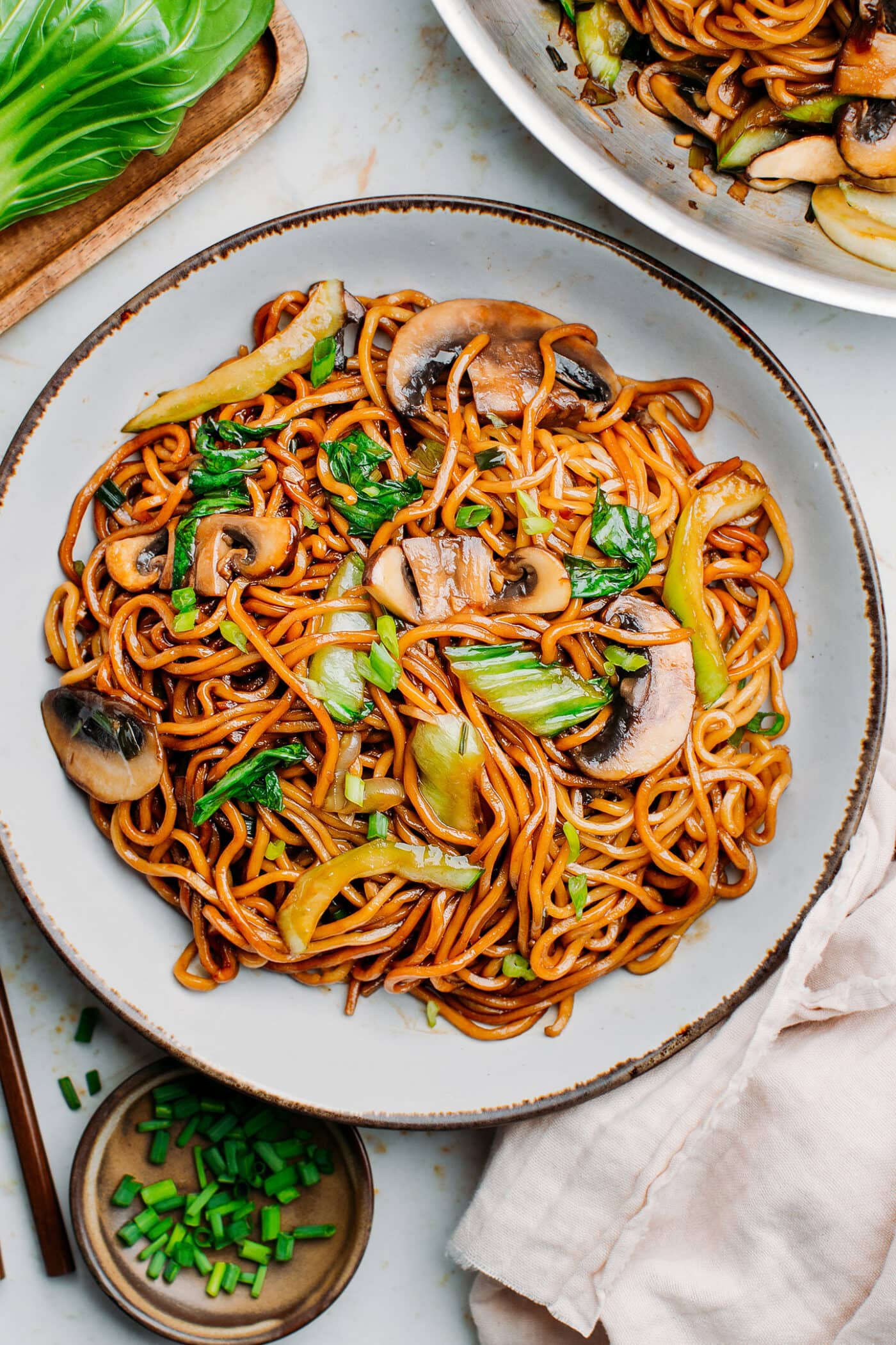 Vegetable Lo Mein with mushrooms and pak choi on a plate.