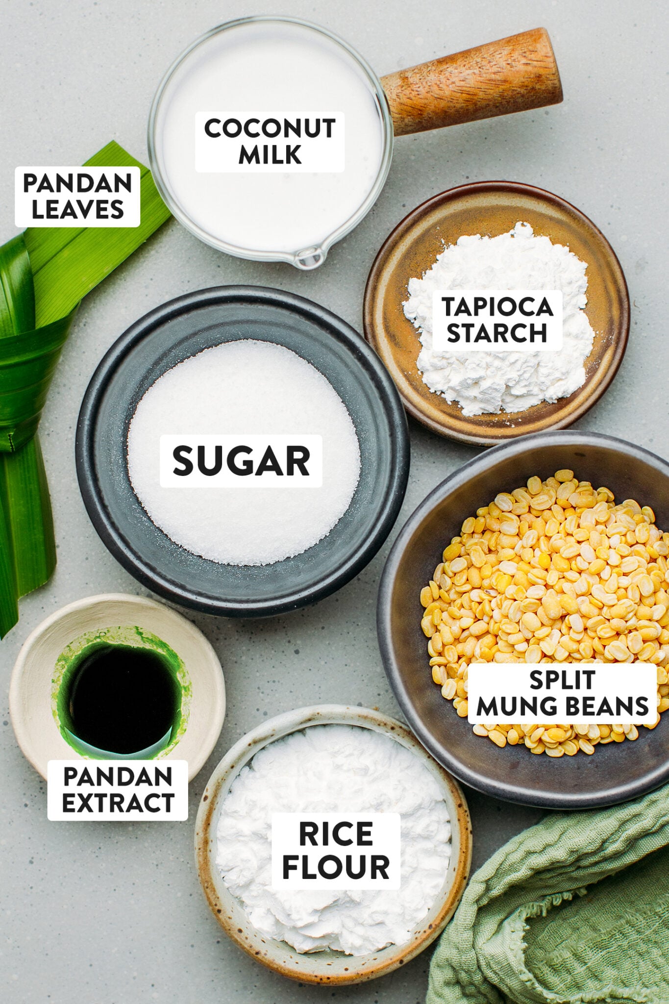 Ingredients like mung beans, pandan leaves, coconut milk,  sugar, and tapioca starch.