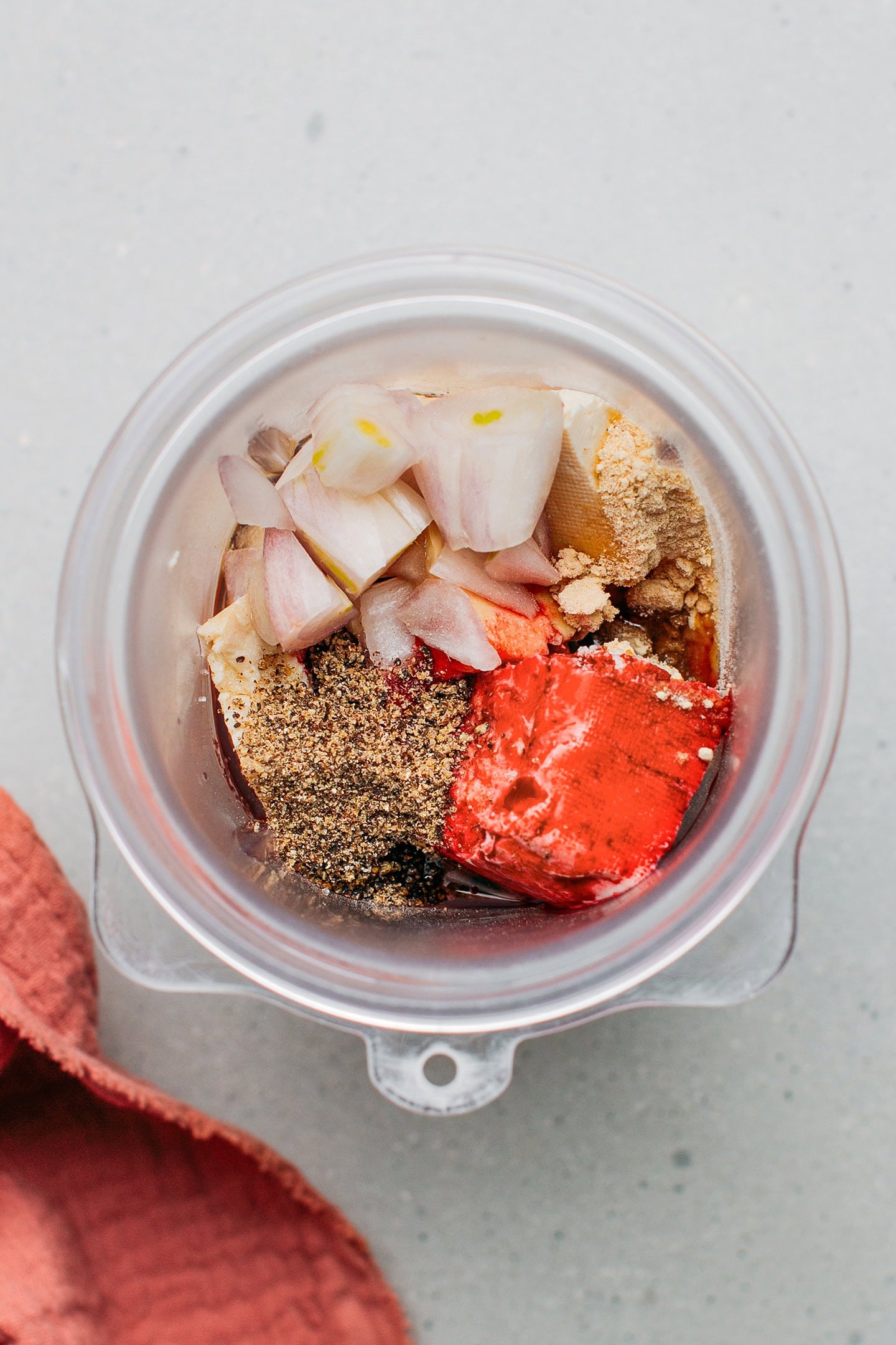 Tofu, shallots, and seasonings in a blender.