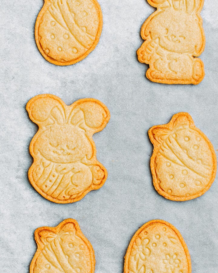 Baked sugar cookies on a baking sheet.