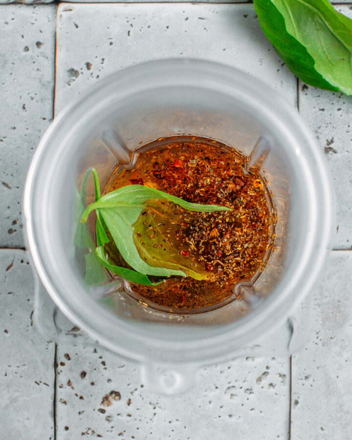 Oil, sun-dried tomato, Italian seasoning, and garlic in a blender.