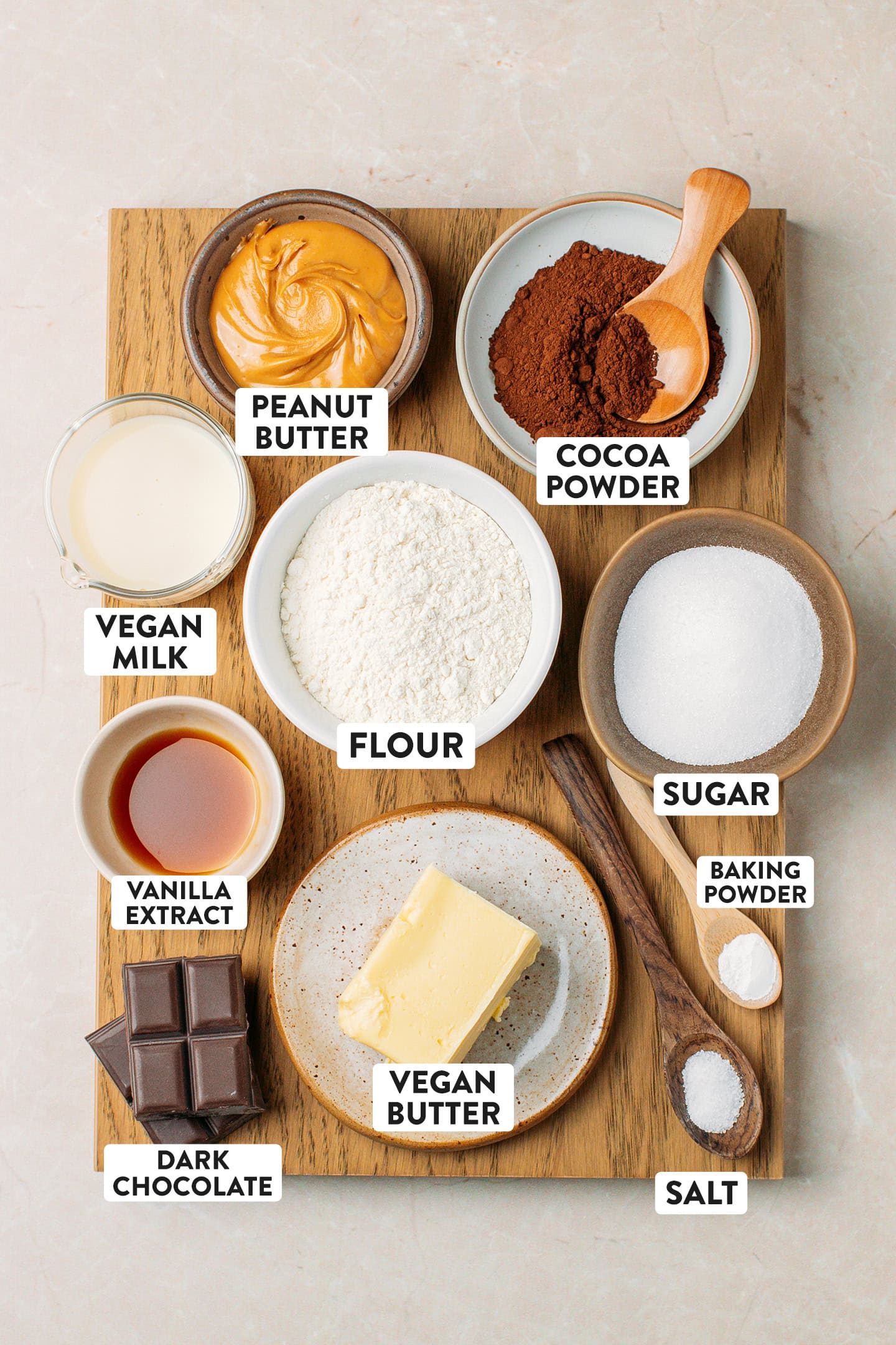 Ingredients like flour, vegan butter, dark chocolate, cocoa powder, and peanut butter.