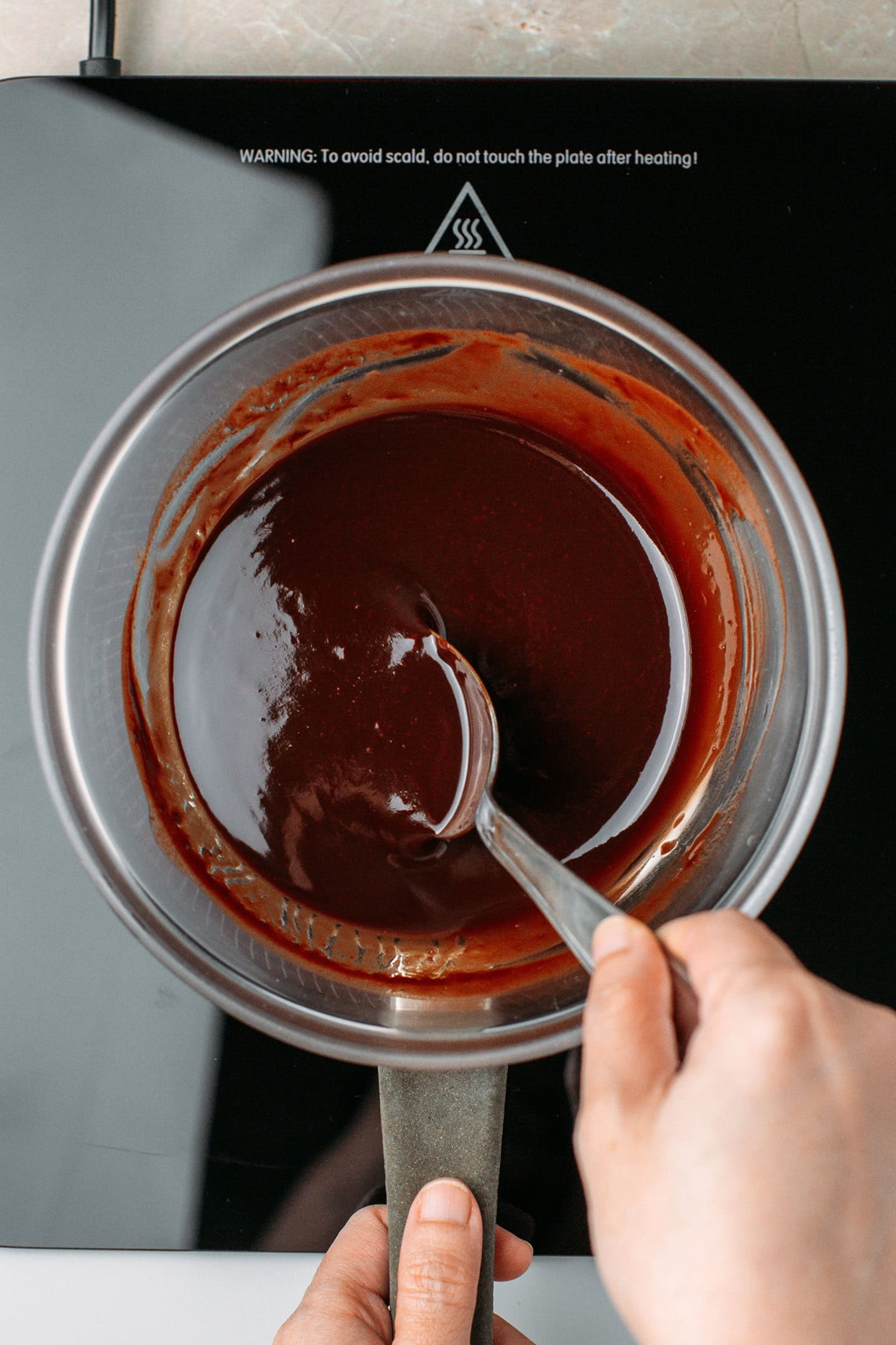 Melted chocolate and butter in a glass bowl.