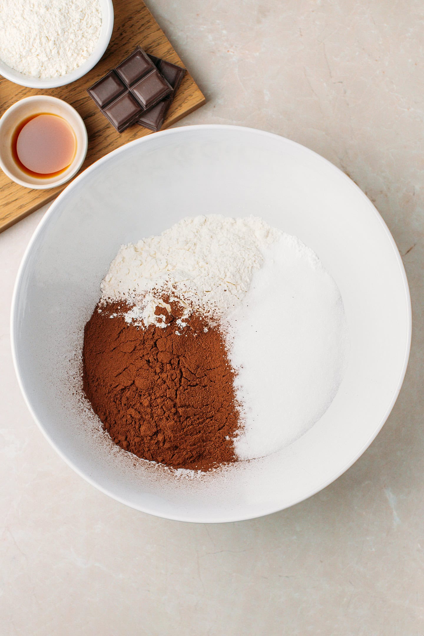 Cocoa powder, flour, and sugar in a mixing bowl.