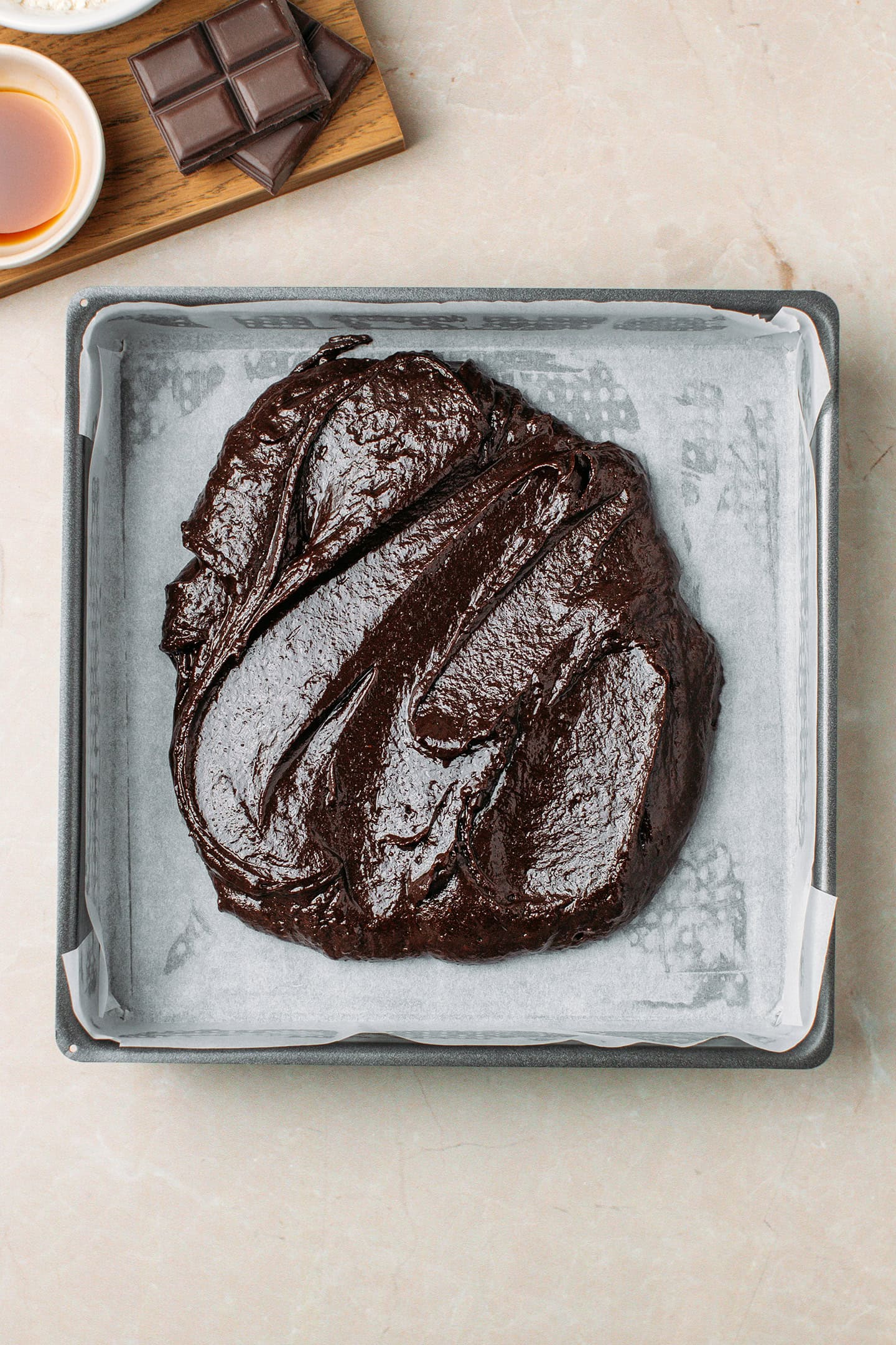 Brownie batter in a baking pan.